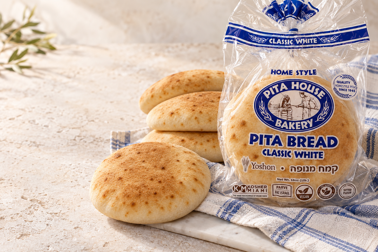 Styled concept of the Pita House Bakery Classic White pita bag with bread
