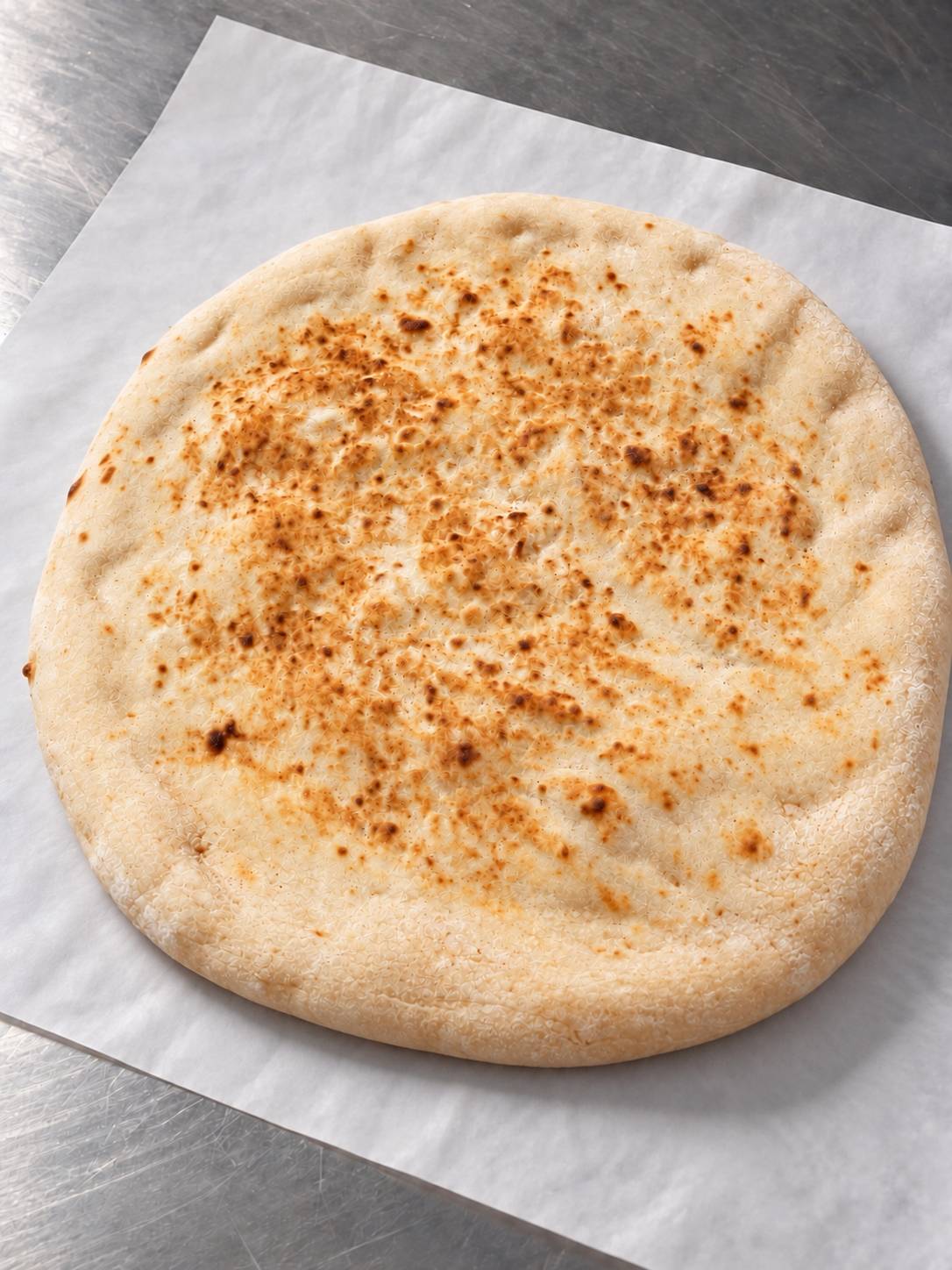Pita House Bakery Laffa bread on a white baker’s sheet