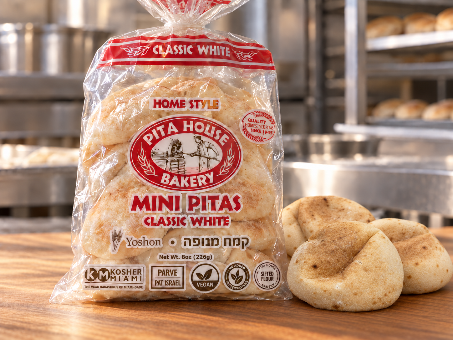 Pita House Bakery Classic White Mini Pitas bag beside mini pita breads